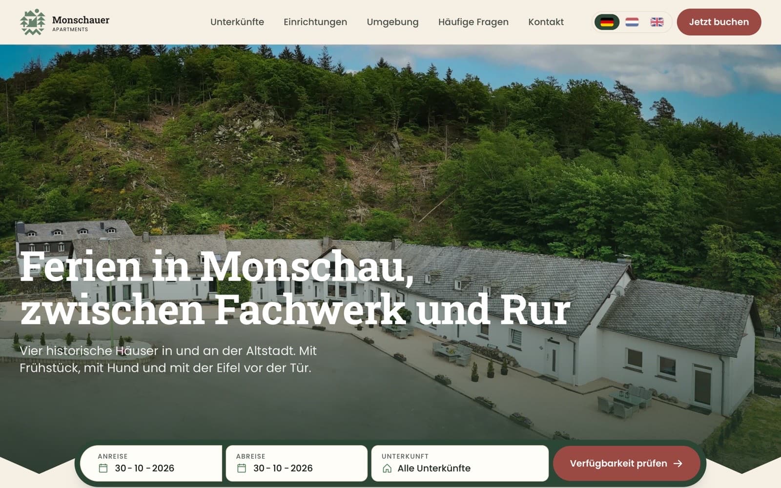 Homepage of monschauerapartments.de with the booking bar over the photo